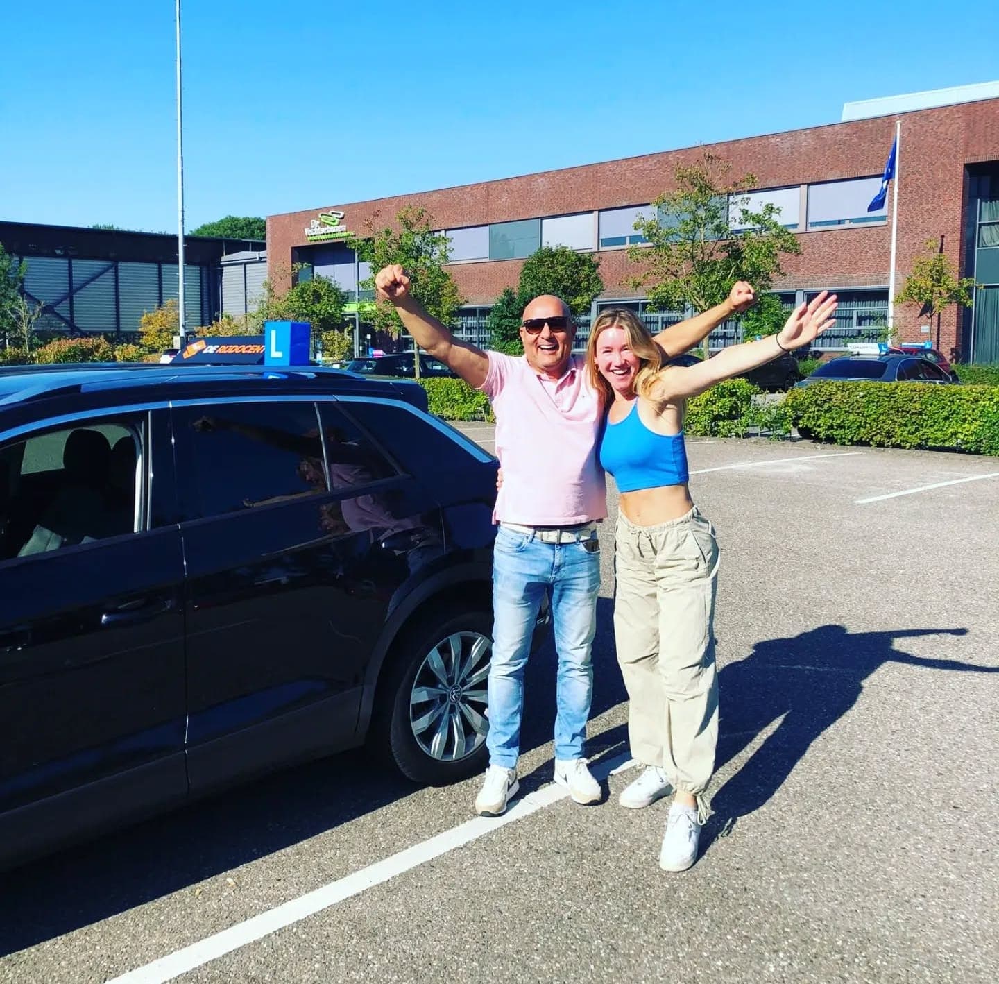 Geslaagde leerling en instructeur van De Rijdocent